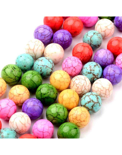 Turquesa sintética. Colores variados. 12 mm diámetro. 1,50 mm perforación. 15 uds hilo (aprox.)