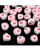 Huellas de perro. Varios colores. 9X10X5 milímetros. 1,2 mm de perforación. 10 unidades.