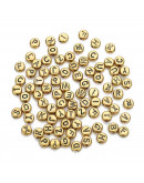 Letra negra. Moneda dorada. 7 milímetros diámetro. 1,5 mm perforación. 100 uds aproximado.