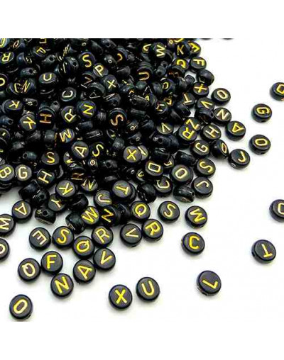 Letra dorada. Moneda negra. 7 milímetros diámetro. 1,5 mm perforación. 100 uds aproximado.