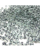 Letra negra. Moneda transparente. 7 milímetros diámetro. 1,5 mm perforación. 100 uds aproximado.