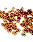 Letra negra. Moneda dorado antiguo. 7 milímetros diámetro. 1,5 mm perforación. 100 uds aproximado.