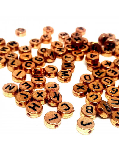 Letra negra. Moneda dorado antiguo. 7 milímetros diámetro. 1,5 mm perforación. 100 uds aproximado.