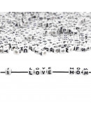 Letra negra. Cubo blanco. 6 milímetros lado. 3 milímetros perforación. 100 uds aproximado.