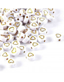 Corazón dorado. Moneda blanca. 7 milímetros lado. 1,5 mm perforación. 100 unidades aproximado.