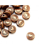 Corazón (1). Cobre. Color cobre antiguo. 6x6x3 milímetros. 1 mm perforación. 20 unidades.