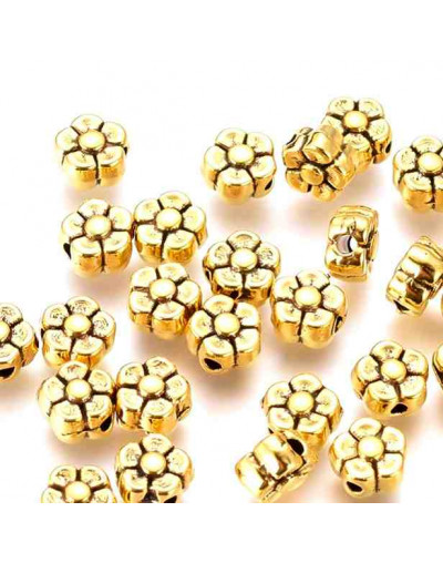 Flor. Aleación de cobre. Color oro antiguo. 5 mm diámetro. 1 mm perforación. 20 unidades.
