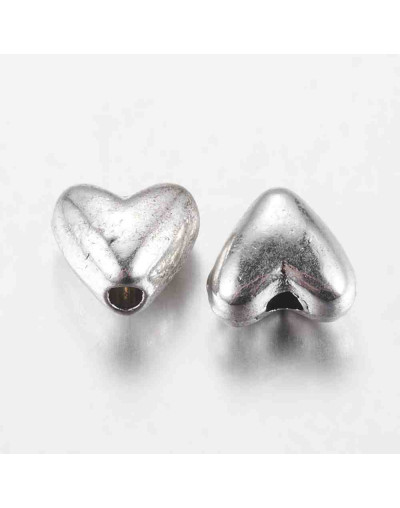 Corazón (3). Aleación de cobre. Color plata antigua. 6 milímetros. 1 mm perforación. 20 unidades.