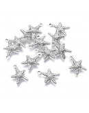 Estrella de mar. Aleacion de cobre. Color plata antigua. 16x12 milímetros. 1 mm perforación. 10 uds. Estrella de mar. Aleacion de cobre. Color plata antigua. 16x12 milímetros. 1 mm perforación. 10 uds.