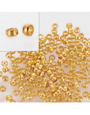 Crimp beads. Aleación. Color dorado. 2,5x1,5 milímetros. 1 mm perforación. 100 unidades (aprox).