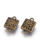 Enlace. Aleación. Color bronce antiguo. 23x15x8 milímetros. 2 mm perforación. 3 unidades