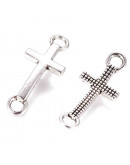 Cruz. Aleación de cobre. Color plateado. 20x8x2 milímetros. 2 mm perforación. 10 unidades.