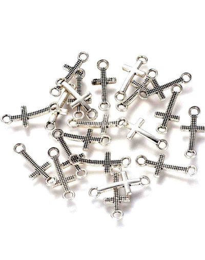 Cruz. Aleación de cobre. Color plateado. 20x8x2 milímetros. 2 mm perforación. 10 unidades.