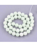 Piedra sintética. Fluorescente. 06 mm diámetro. 1 mm perforación. 65 unidades hilo (aproximado)