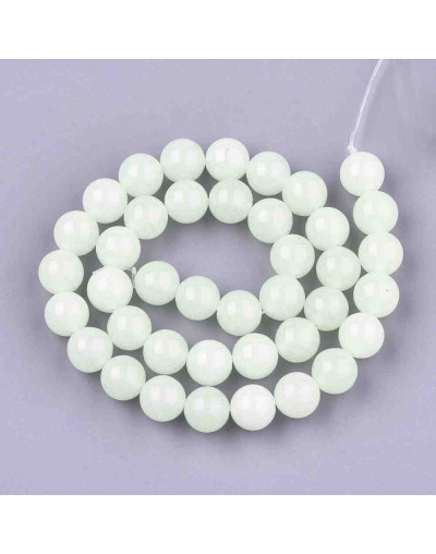 Piedra sintética. Fluorescente. 06 mm diámetro. 1 mm perforación. 65 unidades hilo (aproximado)