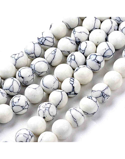 Howlite sintético. Blanco. 06 mm diámetro. 1 mm perforación. 60 unidades hilo (aproximado)