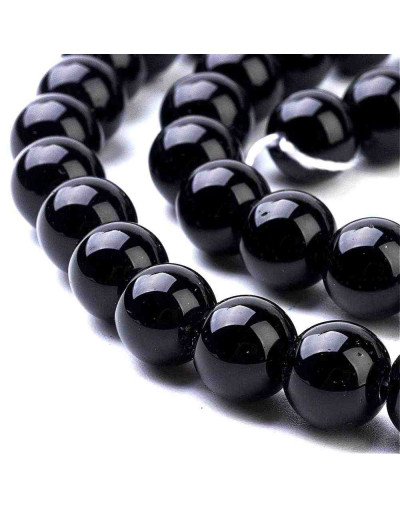 Piedra sintética. Negro brillante. 06 mm diámetro. 1 mm perforación. 60 unidades hilo (aproximado)