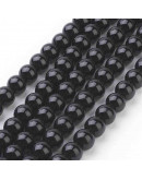 Piedra sintética. Negro brillante. 10 mm diámetro. 1 mm perforación. 35 unidades hilo (aproximado)