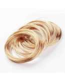 Acero memoria. Color dorado. Calibre 18 (1 mm). 11,50 centímetros diámetro. 10 vueltas.