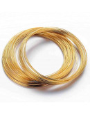 Acero memoria. Color dorado. Calibre 22 (0,6 mm). 5,50 cm diámetro. 20 vueltas.