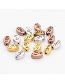 LOVE (1). Aleación de cobre. Color Mixto. 10x6x4 mm. 1 mm perforación. 10 uds
