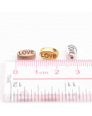 LOVE (1). Aleación de cobre. Color Mixto. 10x6x4 mm. 1 mm perforación. 10 uds