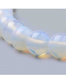 Opalina. 06 mm diámetro. 1 mm perforación. 50 unidades hilo (aproximado)