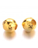 Esfera. Aleación de cobre. Color dorado. 3 mm diámetro. 1,2 mm perforación. 100 unidades aprox.