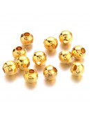 Esfera. Aleación de cobre. Color dorado. 3 mm diámetro. 1,2 mm perforación. 100 unidades aprox.