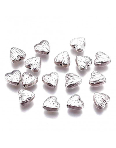 Corazón (5). Aleación de cobre. Color plata antigua. 8x8x4 mm. 1.5 mm perforación. 10 uds.