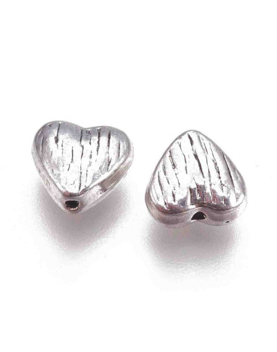 Corazón (5). Aleación de cobre. Color plata antigua. 8x8x4 mm. 1.5 mm perforación. 10 uds.