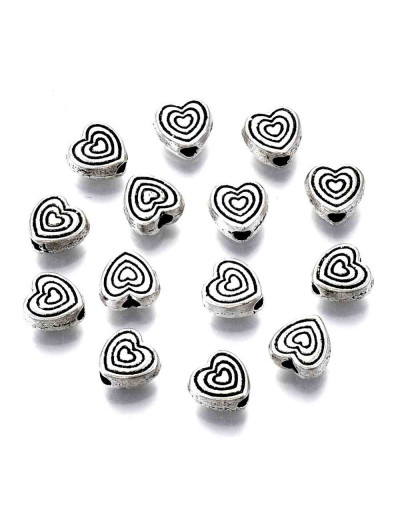 Corazón (6). Aleación de cobre. Color plata antigua. 6x6x3 mm. 1 mm perforación. 20 uds.