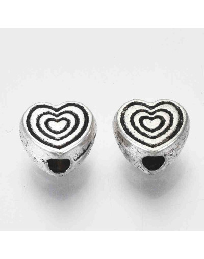 Corazón (6). Aleación de cobre. Color plata antigua. 6x6x3 mm. 1 mm perforación. 20 uds.