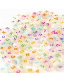 Letra varios colores. Moneda fluorescente. 7 mm diámetro. 1,5 mm perforación. 100 uds aprox.