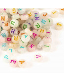 Letra varios colores. Moneda fluorescente. 7 mm diámetro. 1,5 mm perforación. 100 uds aprox.