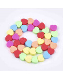 Corazones. Varios colores. 9,5x10x5 milímetros. 1,2 mm perforación. 40 unidades hilo (aproximado).