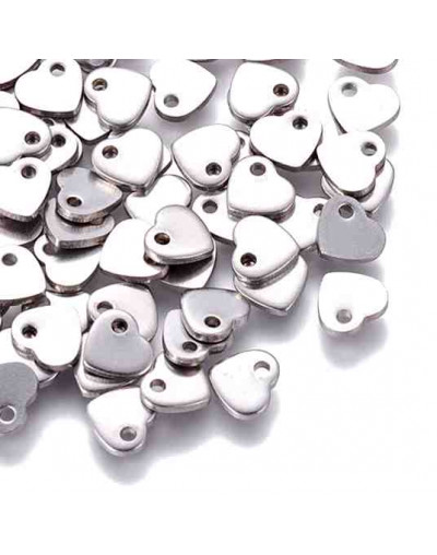 Corazón. Acero inoxidable. Color plateado. 5x6x1 mm. 1 mm perforación. 10 unidades