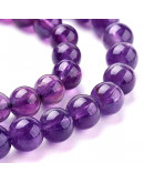 Amatista. 06 mm diámetro. 1 mm perforación. 30 unidades hilo (aproximado).