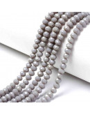 Rondelle faceteado. 4x3 milímetros. Gris. 1 mm perforación. 130 uds hilo (aproximado).