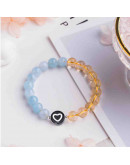 Corazón blanco. Moneda negra. 7 milímetros diámetro. 1,5 mm perforación. 100 uds aproximado.