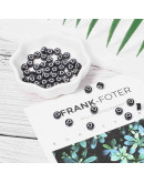 Corazón blanco. Moneda negra. 7 milímetros diámetro. 1,5 mm perforación. 100 uds aproximado.