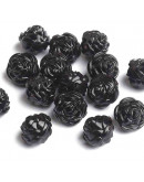 Flor (3). Color negro. 13x8 milímetros. 2 mm perforación. 20 unidades. Flor (3). Color negro. 13x8 milímetros. 2 mm perforación. 20 unidades.