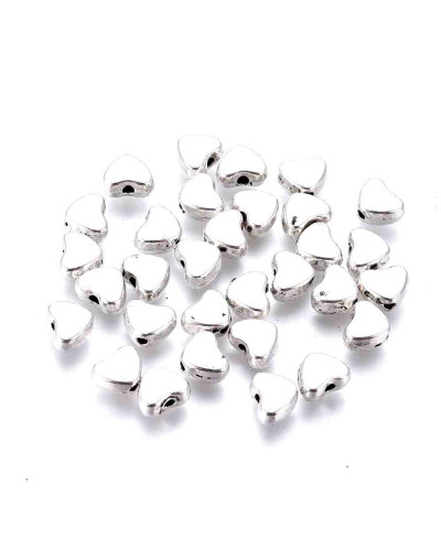 Corazón (2). Aleación de cobre. Color plata antigua. 6x5x5 mm. 1 mm perforación. 20 unidades.