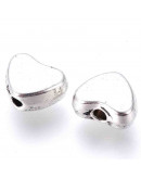 Corazón (2). Aleación de cobre. Color plata antigua. 6x5x5 mm. 1 mm perforación. 20 unidades.