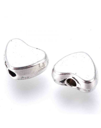 Corazón (2). Aleación de cobre. Color plata antigua. 6x5x5 mm. 1 mm perforación. 20 unidades.