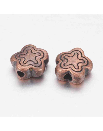 Flores. Cobre. Color cobre antiguo. 7x2,5 mm. 1,5 mm perforación 20 unidades