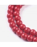 Turquesa sintética. Rojo. 06 mm diámetro. 1 mm perforación. 65 unidades hilo (aproximado)