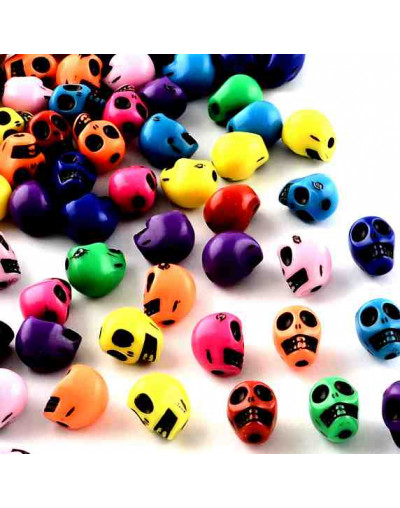 Calavera. Varios colores. 10x8x9 milímetros. 2 mm perforación. 50 unidades aproximado.