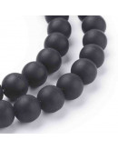 Piedra sintética. Negro mate. 04 mm diámetro. 0,8 mm perforación. 90 unidades hilo (aproximado)