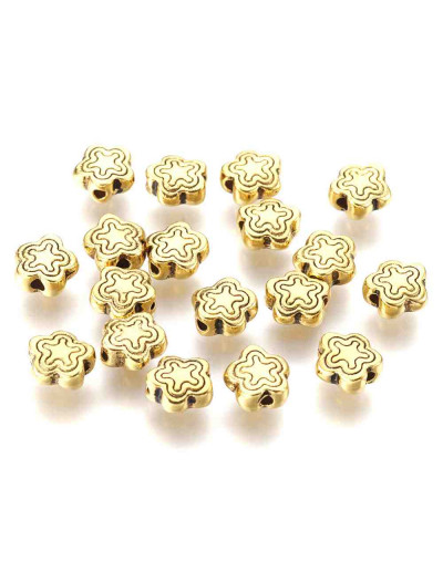 Flores. Aleación de cobre. Color oro antiguo. 7x2,5 milímetros. 1,5 mm perforación. 20 unidades,